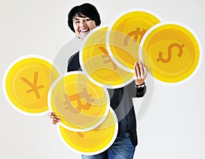 A woman carrying coin icons
