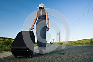 woman carrying a heavy bag