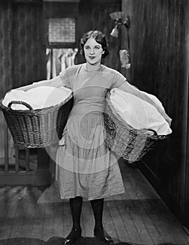 Woman carrying laundry baskets