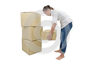 Woman carrying and lifting boxes photo