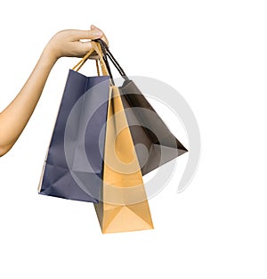 Woman carrying paper shopping bags isolated on white background. Adult woman hand hold three shopping bag with blue and brown