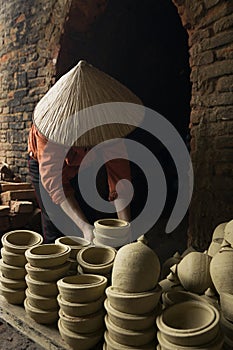 Woman carrying pottery