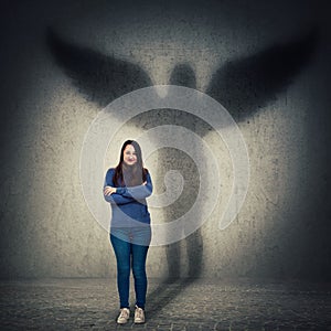 Woman casting angel shadow