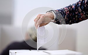 Woman casts her ballot at elections