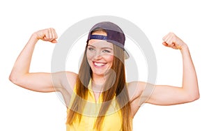 Woman casual style showing off muscles biceps