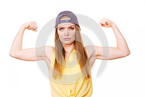 Woman casual style showing off muscles biceps