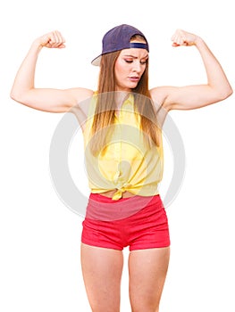 Woman casual style showing off muscles biceps