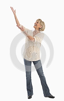 Woman In Casuals With Arms Raised Over White Background
