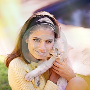 Woman, cat and embrace outdoors in portrait, pet care and smile for affection in backyard or garden. Female person