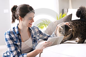 Woman and cat in the living room