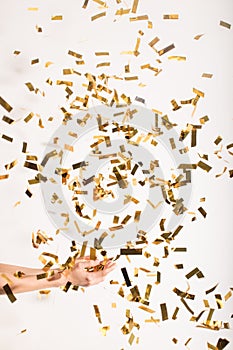 Woman catching falling confetti