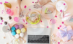 woman celebrating birthday using laptop, top view flat lay