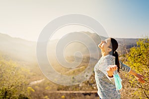 Woman celebrating without mask.Concept of defeating illness.Recovered from coronavirus.Cured disease emotional patient.Covid-19