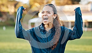 Woman, celebration and winner with excited athlete on a field for sport, game and workout. Training, yes and fitness
