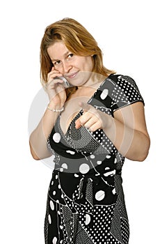 Woman on cellphone with finger pointing at viewer