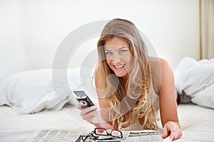 Woman, cellphone and relax on bed, morning and communication with portrait and happy. Contact, technology and social