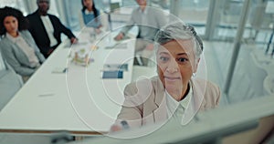 Woman CEO at whiteboard in conference room with business people, writing ideas for planning and strategy at startup