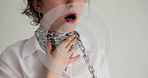 Woman with chain around her neck and sore throat
