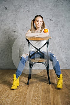 Woman on chair backwards