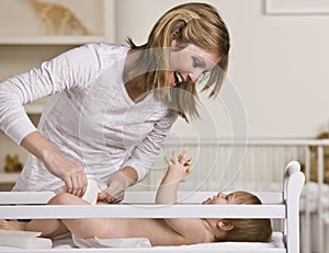 Woman Changing Baby