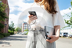 Woman Charging Mobile Phone