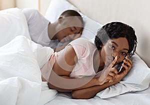 Woman cheating on her husband, talking with lover on phone