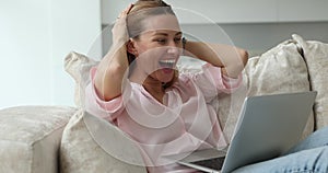 Woman check email on laptop scream with joy celebrate win