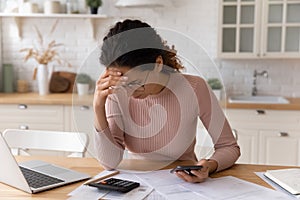 Woman check personal finances, calculate domestic bills feels stressed