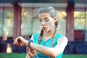 Woman checking amazing good results on smartwatch