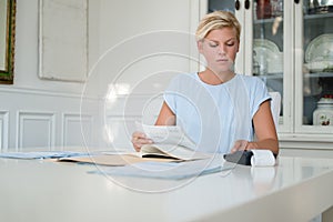 Woman checking bills and doing budget