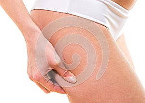 Woman checking cellulite on her buttocks