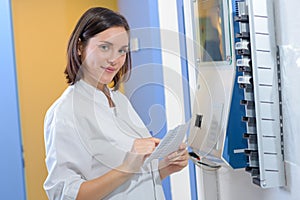 Woman checking clocking in station photo