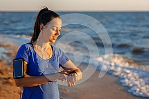 Woman checking distance and heart rate