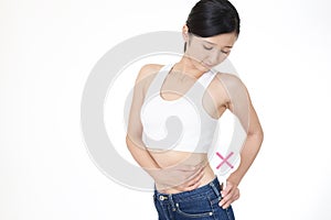 Woman checking fat on her belly