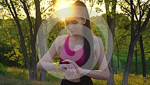 Woman checking fitness and health tracking wearable device.