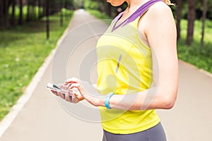 Woman checking fitness and health tracking wearable device