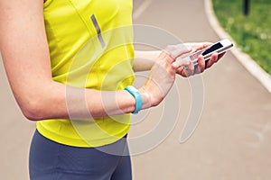 Woman checking fitness and health tracking wearable device