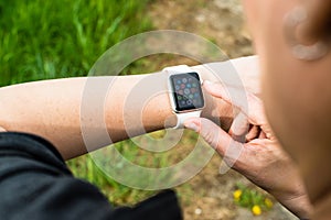 Woman checking her Apple Watch