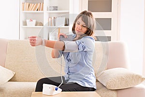 Woman checking her blood pressure