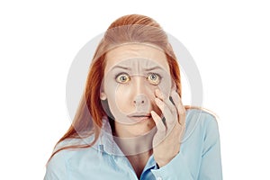 Woman checking her health condition looking into her eye