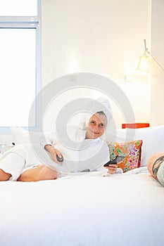 woman checking her phone in the bedroom - social media dependency