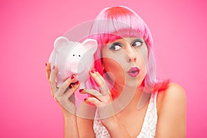 Woman checking her piggy bank