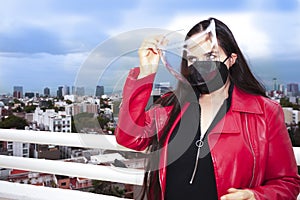 Woman checking that her plastic brace is in perfect condition before placing it on her face