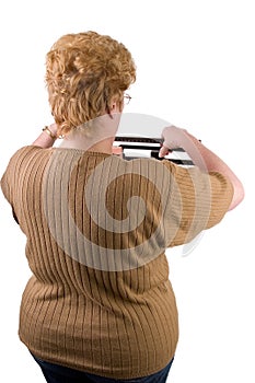 Woman checking her weight on scale