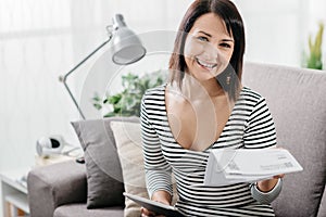 Woman checking household bills