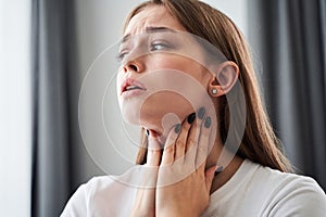 Woman checking lymph nodes