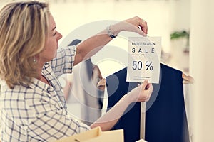 Woman checking out discounted clothes