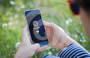 woman checking roaming on her smartphone