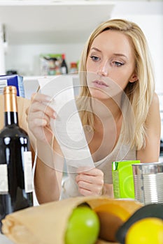 woman checking shopping list