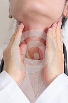 Woman checking Thyroid gland disease. Hand holding Neck pain. Hyperthyroidism, Hypothyroidism, Hashimoto Thyroiditis, Thyroid